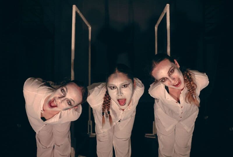 Three performers on swings, photographed by CamLah.